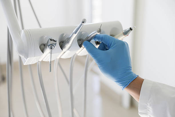 Professional Tooth Extraction technician working in Cottage Grove, MN